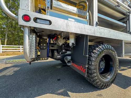 Low underside side view showing frame rail and suspension components.